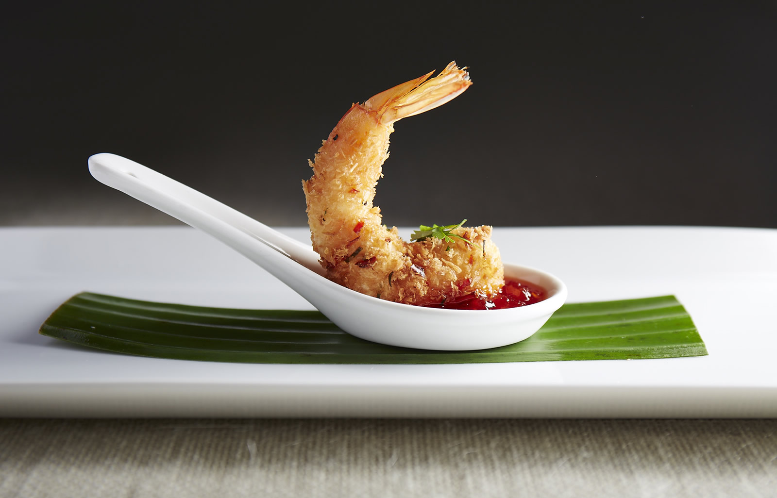 coconut and lime leaf crusted tiger prawns with chili sambal 